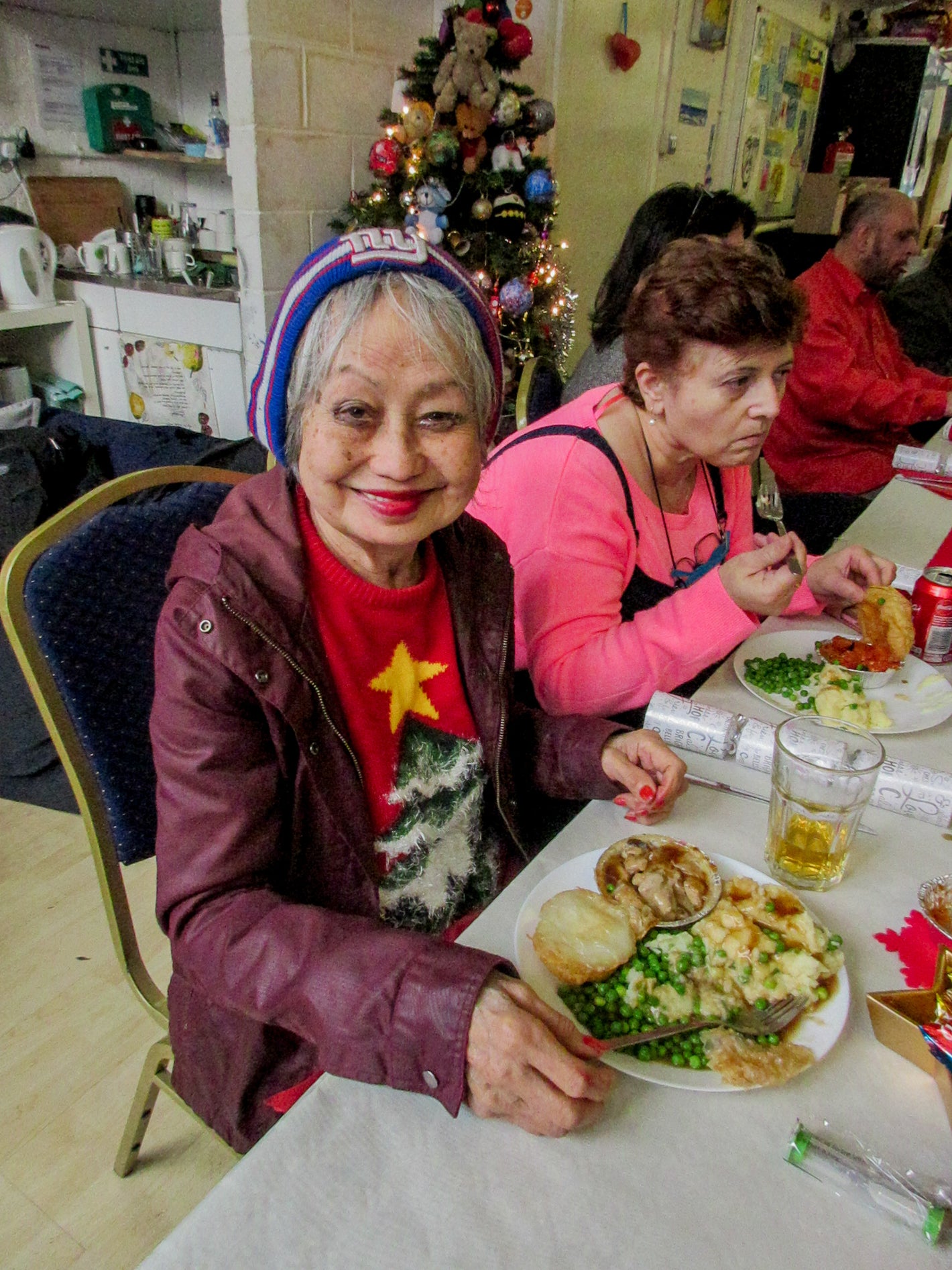 Woman smiling with her Christmas dinner.