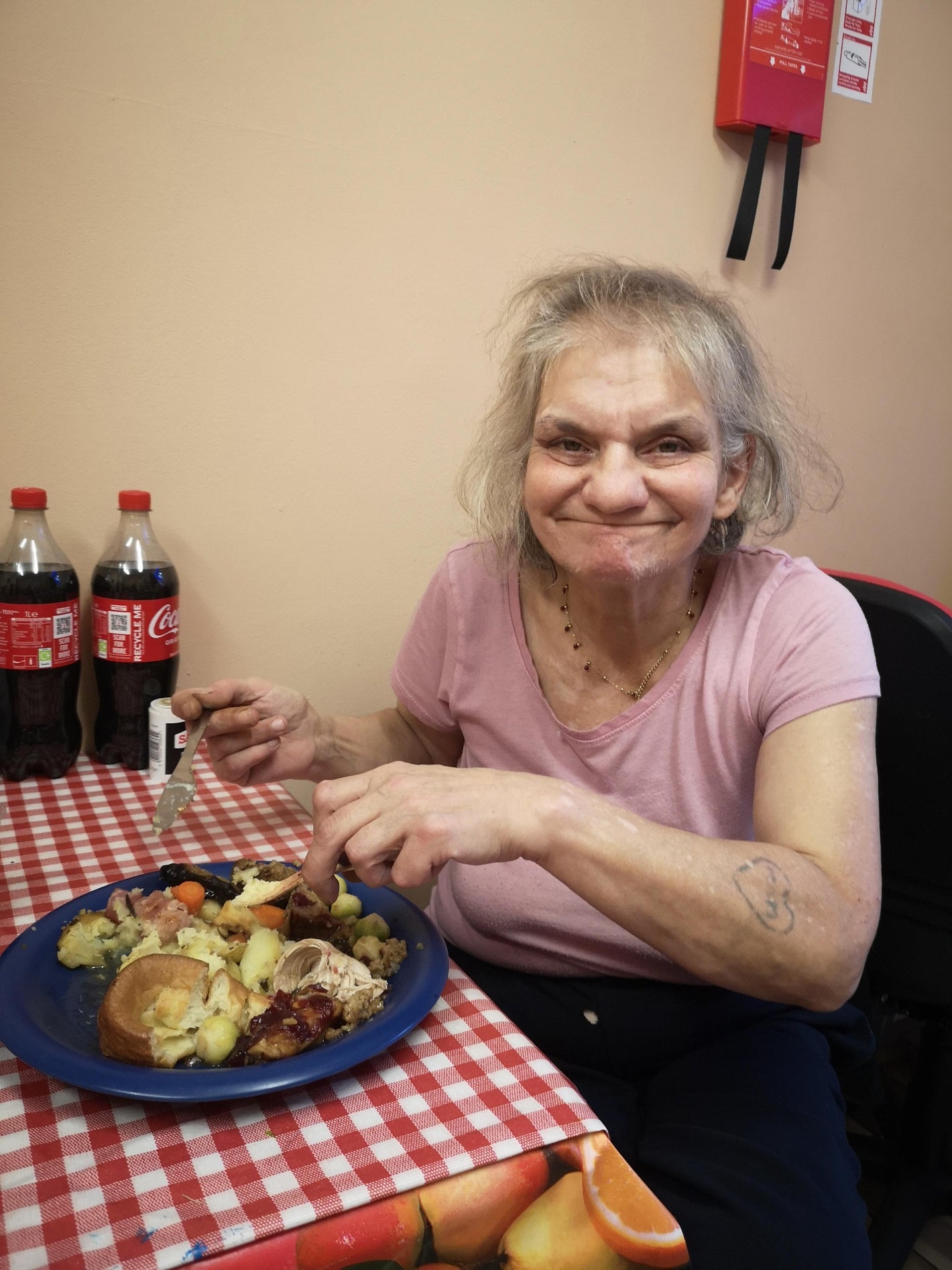 Woman smiling with a Christmas dinner.