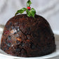 Christmas pudding with holly on top.