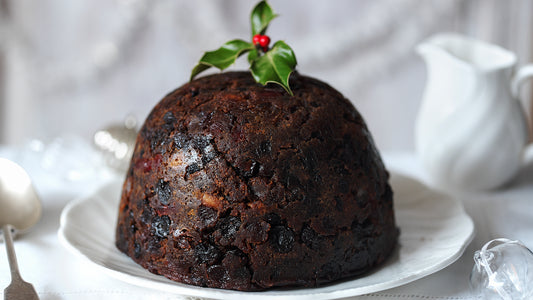 Christmas pudding with holly on top.