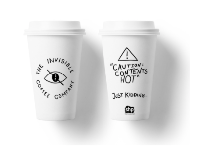 Two Invisible Coffee Company reusable coffee cups. One with the logo and the other with "The coffee that never gets cold. SHP" on.